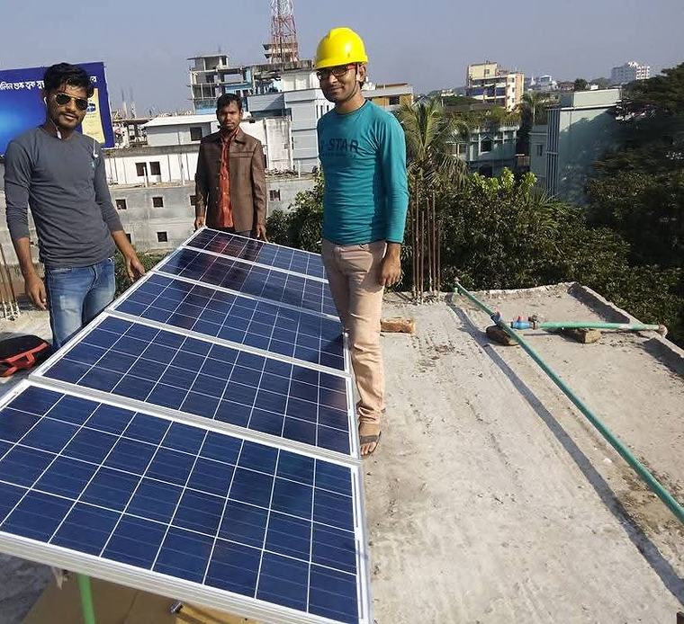 শহরের ভবনের ছাদে কাজের ফাঁকে আমাদের টিম